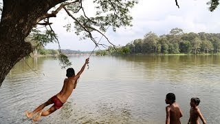 Khmer boys playing in Angkor Wat moat water canal  Siem Reap Cambodia [upl. by Niwred219]